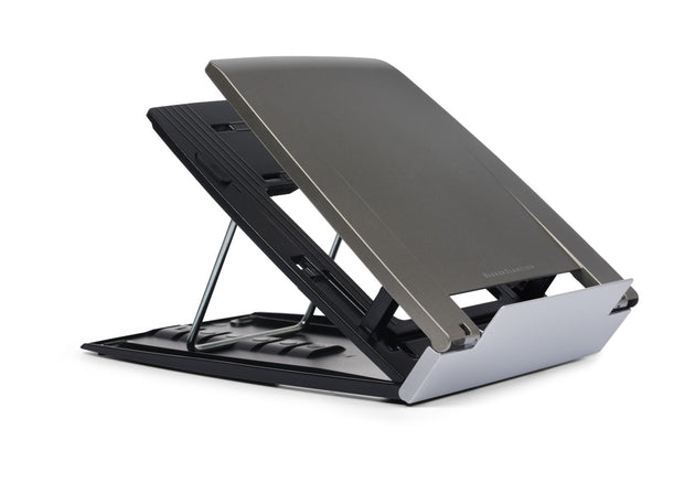 A silver Ergo-Q 330 laptop riser with adjustable height settings, folded to a certain angle, displaying its integral document holder.
