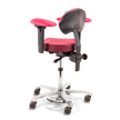 Pink and black surgical adjustable chair on a white background