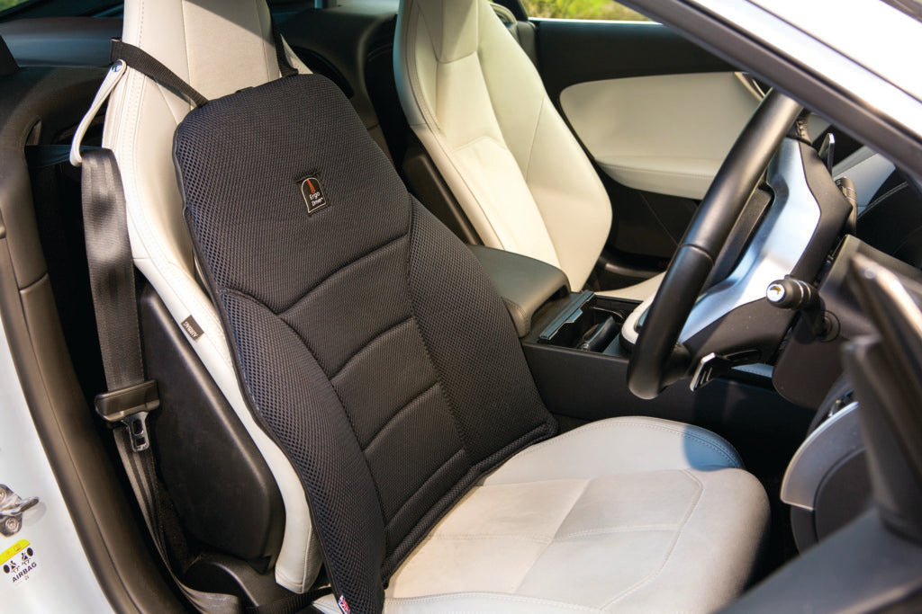 image showing the black ergodriver in drivers seat of car