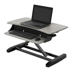 wood effect Ergotron Workfit-Z Mini Sit-stand Unit, shown with laptop, keyboard and mouse