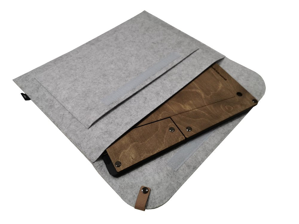 A wooden laptop stand made from sustainable timber, shown partially holding a laptop with a grey case.