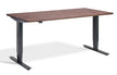 bronze effect desk with black metal legs on a white background