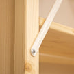 Wooden shelf with metal bracket on a wooden surface