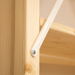 Wooden shelf with metal bracket on a wooden surface