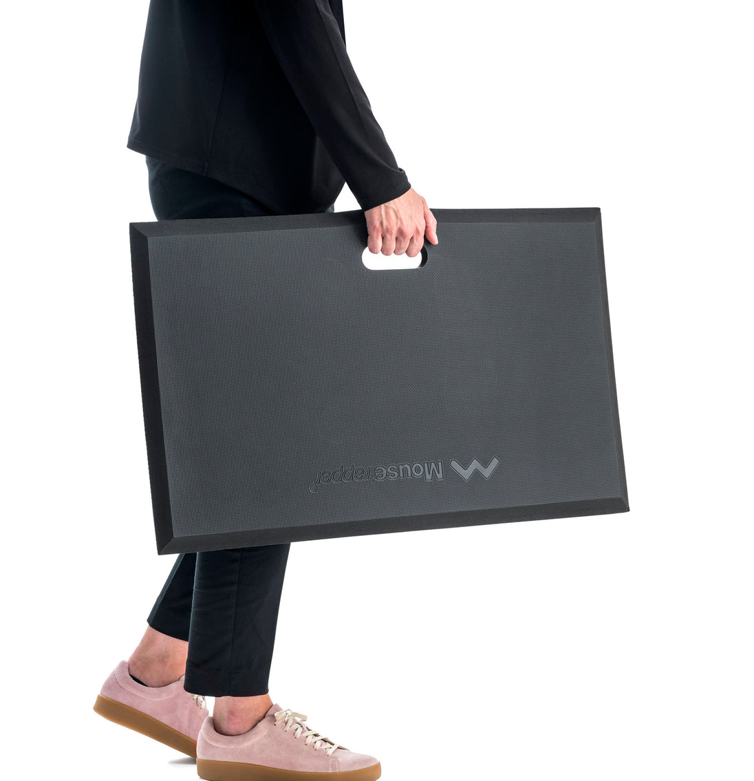 person carrying anti fatigue mat using in-built handle