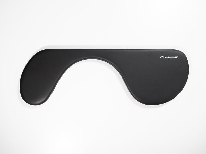 A black Mousetrapper asymmetric arm support rest, designed to fit on a desk workstation.