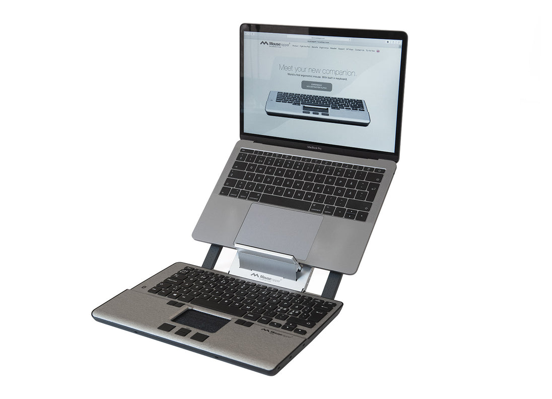 laptop on laptop riser with mousetrapper alpha mouse and keyboard in front