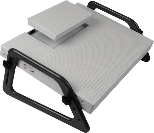 A white and gray Relax footrest with adjustable parts and a compartment for a dictation pedal.