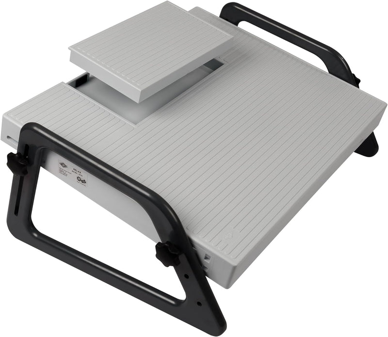 A white and gray Relax footrest with adjustable parts and a compartment for a dictation pedal.