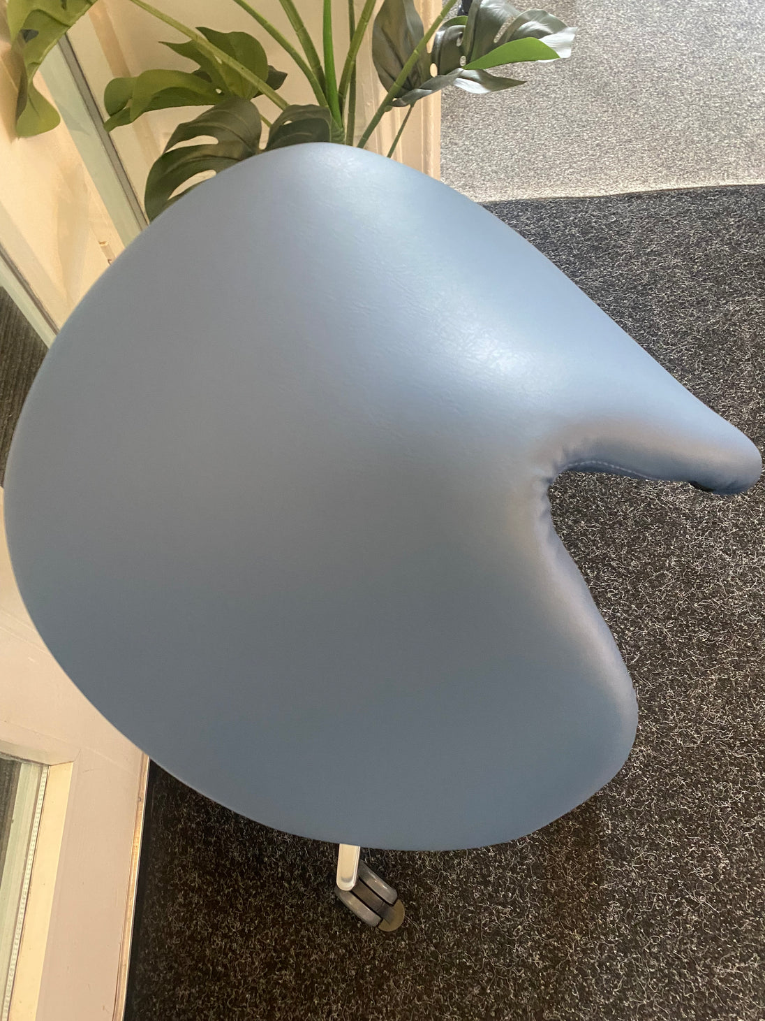 salli saddle chair for dentists in smoke grey leather