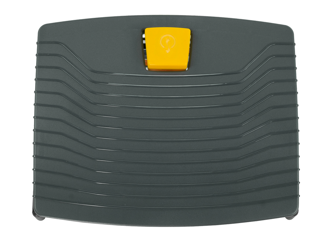 black footrest with orange button for height adjustment