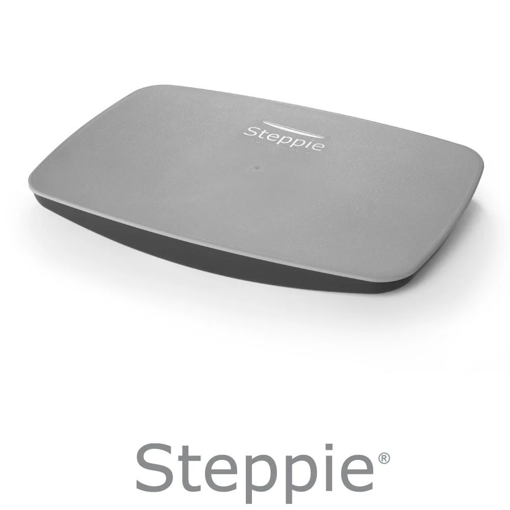 A gray Steppie balance board with the brand logo visible on the surface.
