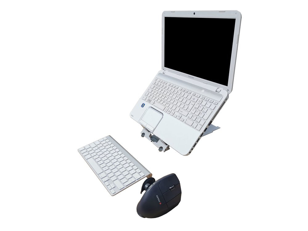 A silver laptop folded open on a stand with a detachable keyboard and a mouse, showcasing a portable ergonomic solution for laptop and tablet use.