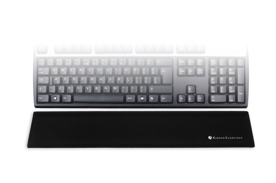 image showing black trapezium standard wrist support in front of a standard size keyboard