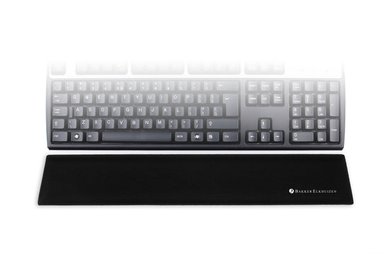 image showing black trapezium standard wrist support in front of a standard size keyboard